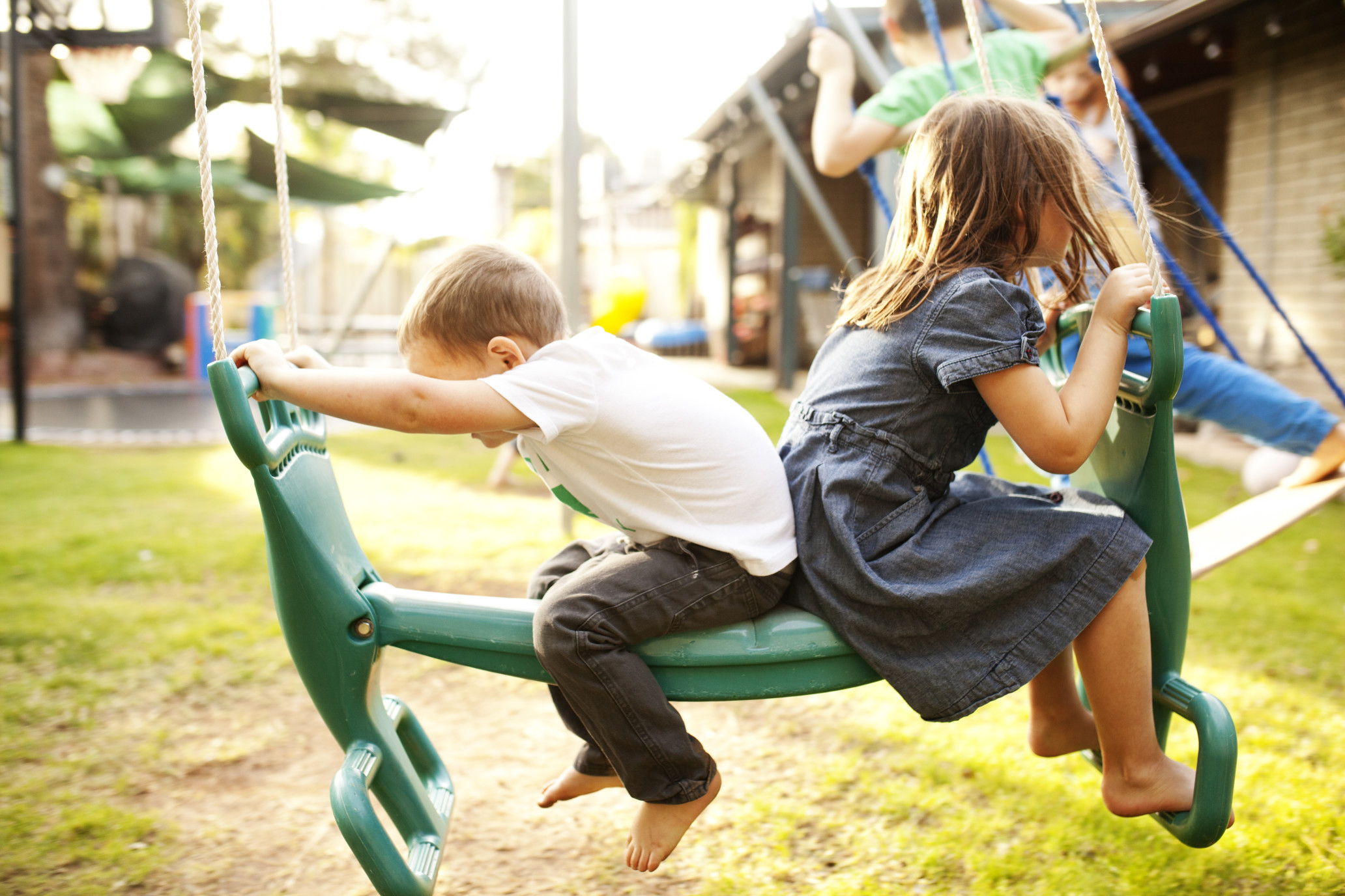 Children playing on playground equipment